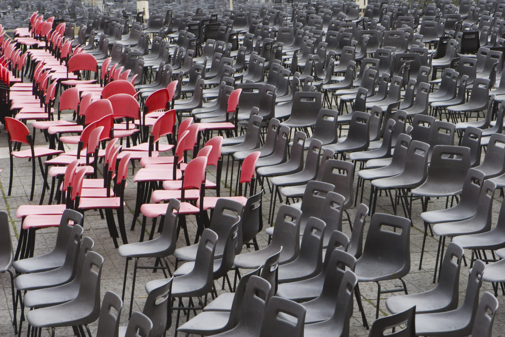 All empty chairs in red and black