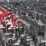 All empty chairs in red and black